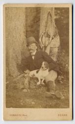 Albert Schwab-Boell (1828-1915), assis avec un chien de chasse by Corrodi
